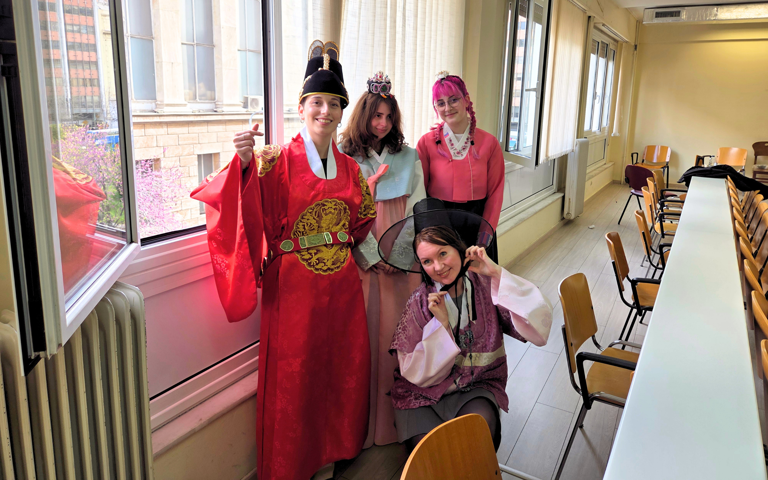 Participants try on traditional Korean hanbok during the “Korean Culture Day - Korean Food & Dining Culture” event at the Foreign Language Center in Athens, on April 3 (by Koreaculture.gr)
